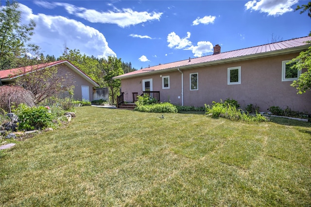 8319 Canyon Ferry Rd, Helena, MT 59602 - view of green lawn featuring a deck