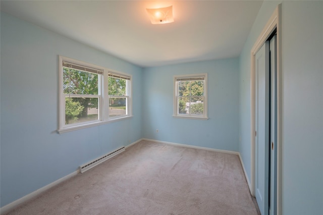 2129 E 6th Ave, Helena, MT 59601 - unfurnished room featuring a baseboard radiator and carpet