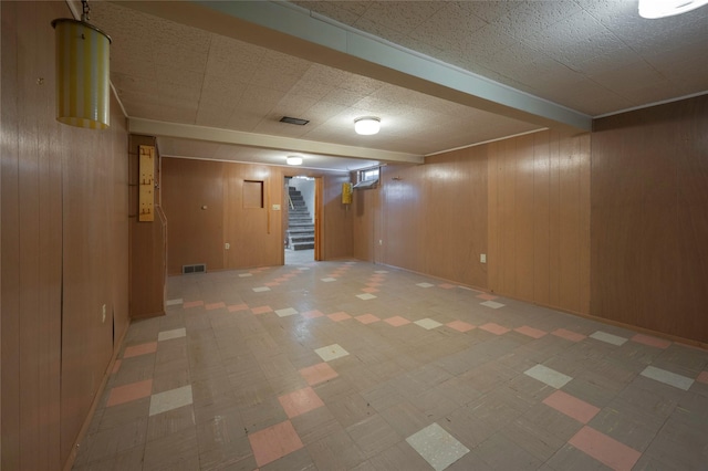 2129 E 6th Ave, Helena, MT 59601 - finished basement featuring light floors, stairway, and wooden walls