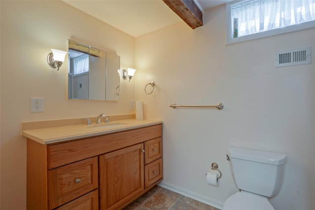 2129 E 6th Ave, Helena, MT 59601 - bathroom featuring plenty of natural light, beamed ceiling, and vanity