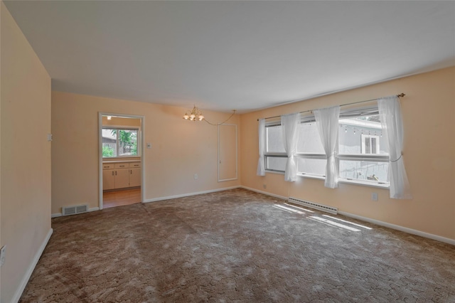 2129 E 6th Ave, Helena, MT 59601 - empty room with a chandelier and carpet floors