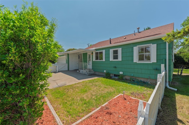 2129 E 6th Ave, Helena, MT 59601 - back of house with roof with shingles and a garage