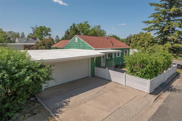 2129 E 6th Ave, Helena, MT 59601 - view of front facade featuring a garage and concrete driveway