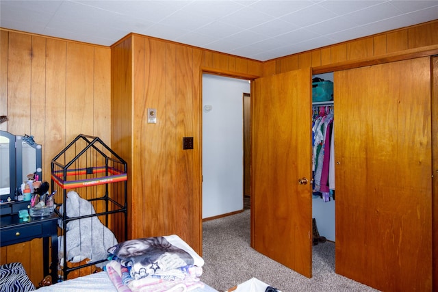 440 Dome Mountain Rd, Libby, MT 59923 - bedroom with carpet flooring, wooden walls, and a closet