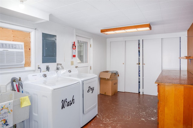 440 Dome Mountain Rd, Libby, MT 59923 - laundry room featuring separate washer and dryer, electric panel, cabinet space, and a wall unit AC