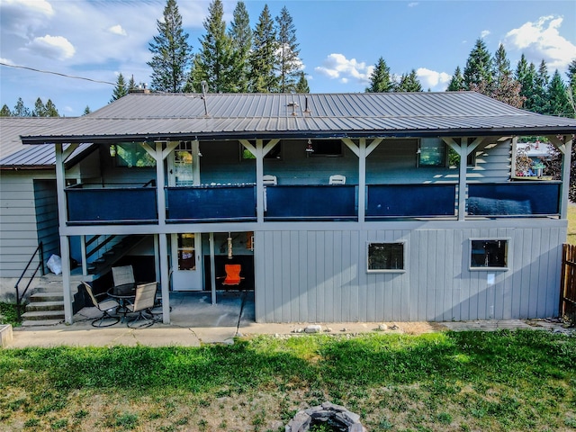 440 Dome Mountain Rd, Libby, MT 59923 - back of house featuring a metal roof, a patio area, and stairs
