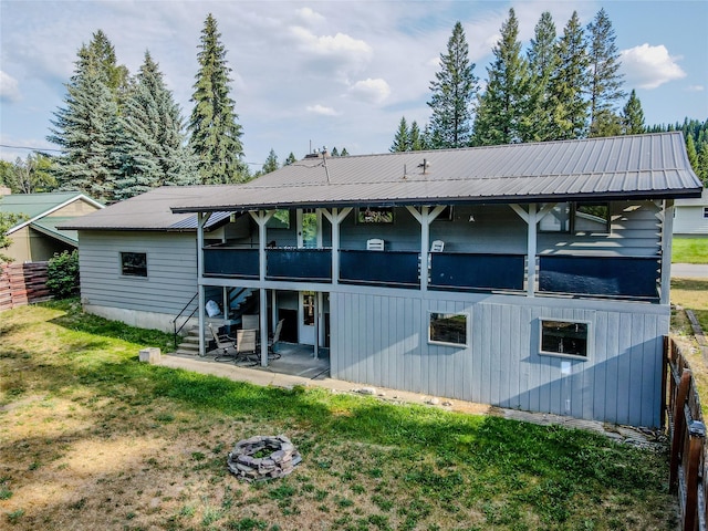440 Dome Mountain Rd, Libby, MT 59923 - rear view of property featuring a metal roof and a patio area