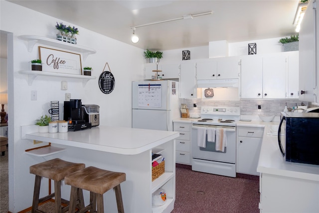 440 Dome Mountain Rd, Libby, MT 59923 - kitchen with open shelves, white appliances, a peninsula, under cabinet range hood, and dark carpet