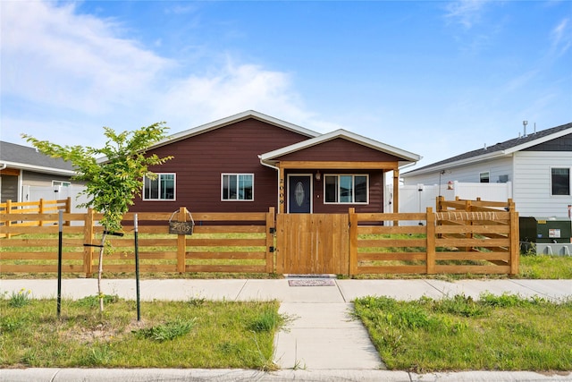 2009 22nd Ave S, Great Falls, MT 59405 - view of front of home with a gate and a fenced front yard