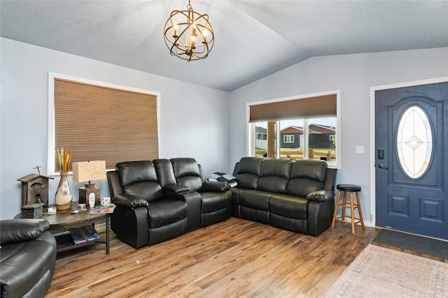 2009 22nd Ave S, Great Falls, MT 59405 - living area featuring vaulted ceiling, wood finished floors, and a chandelier