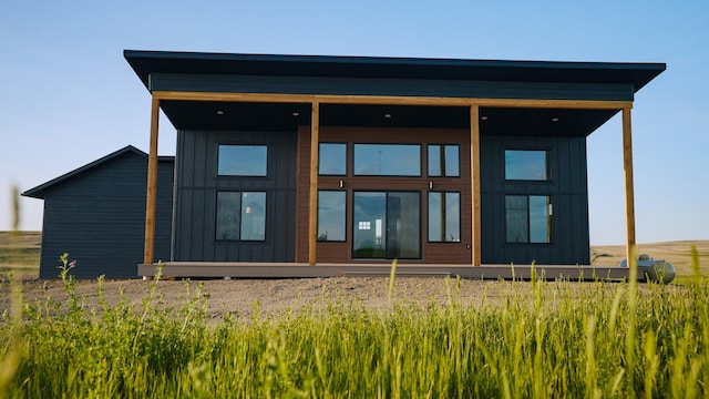 406 2nd Rd SW, Fairfield, MT 59436 - rear view of property featuring board and batten siding