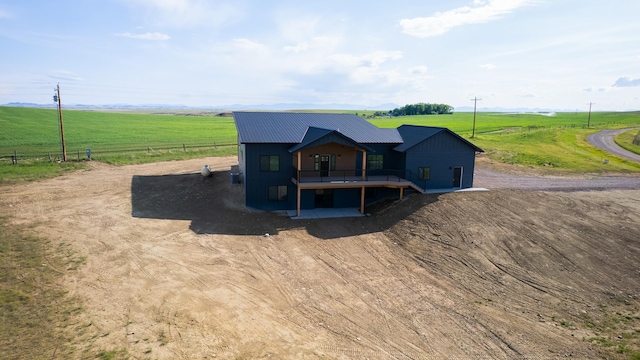 406 2nd Rd SW, Fairfield, MT 59436 - view of front of house with a view of rural / pastoral area, a metal roof, and a deck