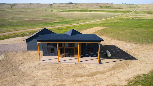 406 2nd Rd SW, Fairfield, MT 59436 - rear view of house with a rural view, a metal roof, and board and batten siding