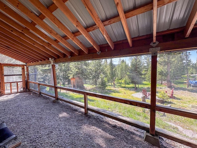 912 Muskrat Rd, Helmville, MT 59843 - unfurnished sunroom featuring view of scattered trees