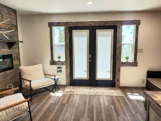 20536 Wild Horse Ranch Rd, Rollins, MT 59931 - foyer entrance featuring french doors, wood finished floors, recessed lighting, and a fireplace
