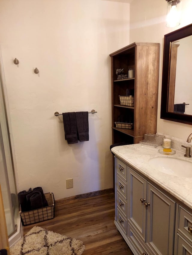 20536 Wild Horse Ranch Rd, Rollins, MT 59931 - bathroom featuring vanity and wood finished floors