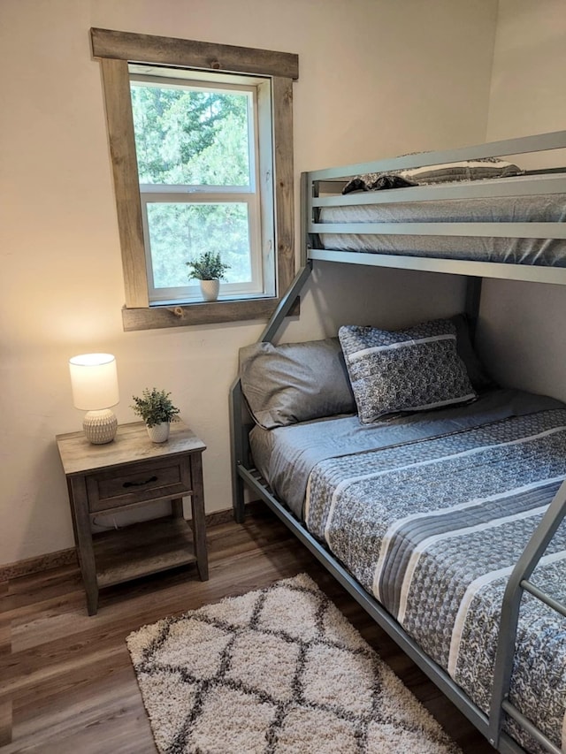 20536 Wild Horse Ranch Rd, Rollins, MT 59931 - bedroom featuring wood finished floors and baseboards