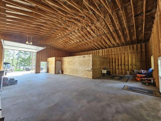 20536 Wild Horse Ranch Rd, Rollins, MT 59931 - misc room with concrete floors, vaulted ceiling, and a garage