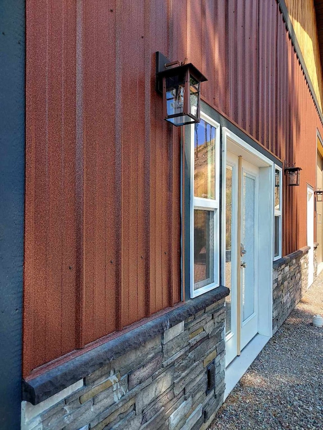 20536 Wild Horse Ranch Rd, Rollins, MT 59931 - view of exterior entry featuring stone siding
