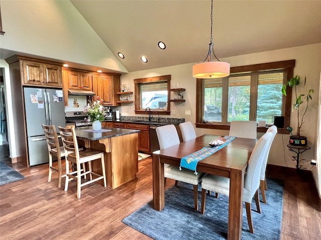 120 Chickadee Way, Whitefish, MT 59937 - dining space featuring wood finished floors, recessed lighting, and high vaulted ceiling