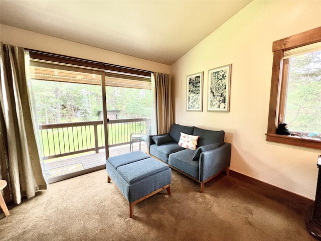 120 Chickadee Way, Whitefish, MT 59937 - carpeted living area featuring vaulted ceiling and baseboards