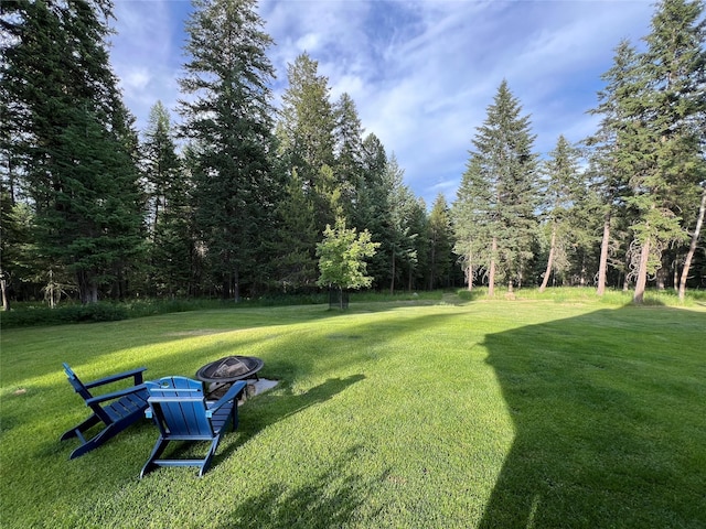 120 Chickadee Way, Whitefish, MT 59937 - view of grassy yard featuring a fire pit