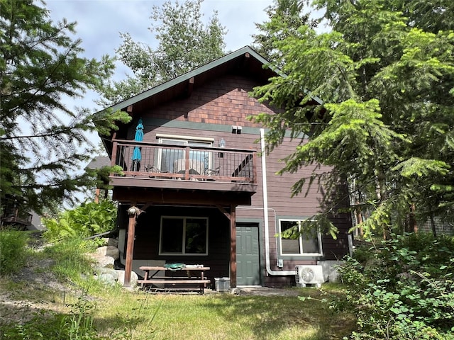 120 Chickadee Way, Whitefish, MT 59937 - rear view of house featuring a balcony