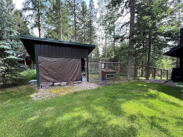 120 Chickadee Way, Whitefish, MT 59937 - view of yard featuring an outdoor structure and a gate