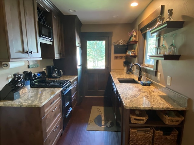 120 Chickadee Way, Whitefish, MT 59937 - kitchen featuring open shelves, black appliances, light stone counters, dark wood finished floors, and recessed lighting
