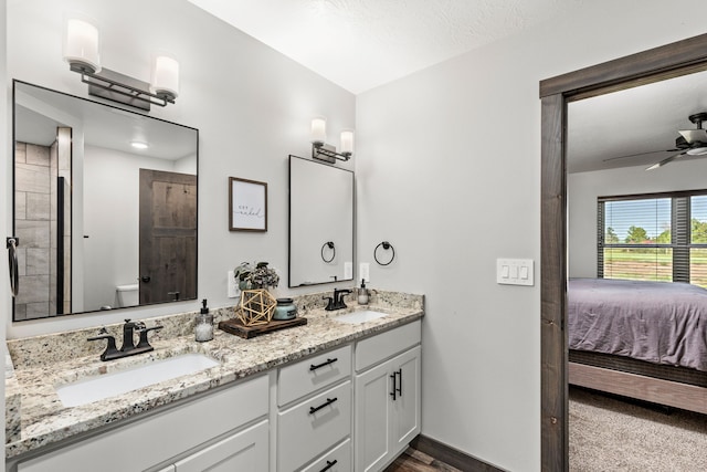 1 Arizona Rd, Great Falls, MT 59404 - ensuite bathroom with double vanity, a ceiling fan, and wood finished floors
