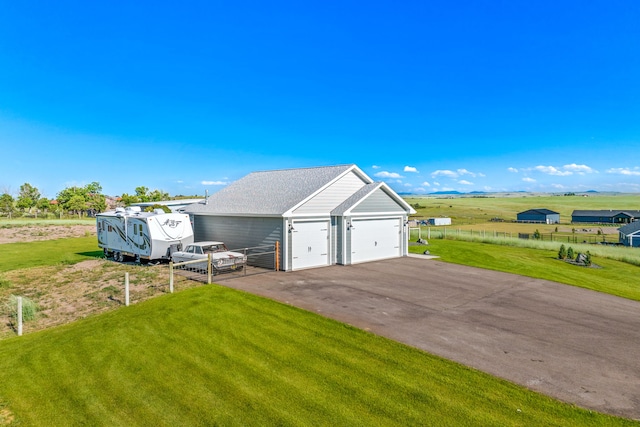 1 Arizona Rd, Great Falls, MT 59404 - view of side of home with a yard, a garage, and an outbuilding