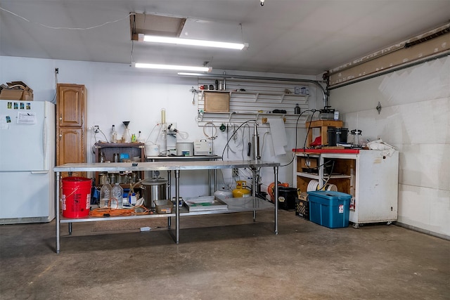 3333 Middle Rd, Columbia Falls, MT 59912 - garage with freestanding refrigerator and a workshop area