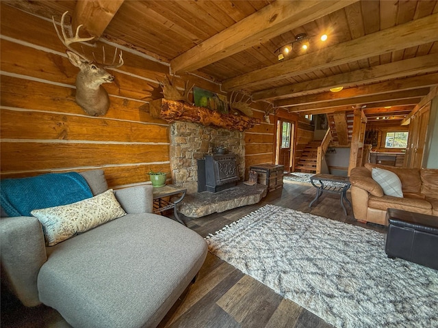 23254 Dayton Creek Rd, Proctor, MT 59929 - living area with hardwood / wood-style flooring, a wooden ceiling with exposed beams, a wood stove, stairway, and wooden walls