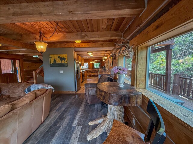 23254 Dayton Creek Rd, Proctor, MT 59929 - dining room with wood finished floors, stairway, a wooden ceiling with exposed beams, and wooden walls