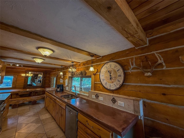 23254 Dayton Creek Rd, Proctor, MT 59929 - kitchen with wood walls, stainless steel dishwasher, dark countertops, beam ceiling, and light tile patterned floors