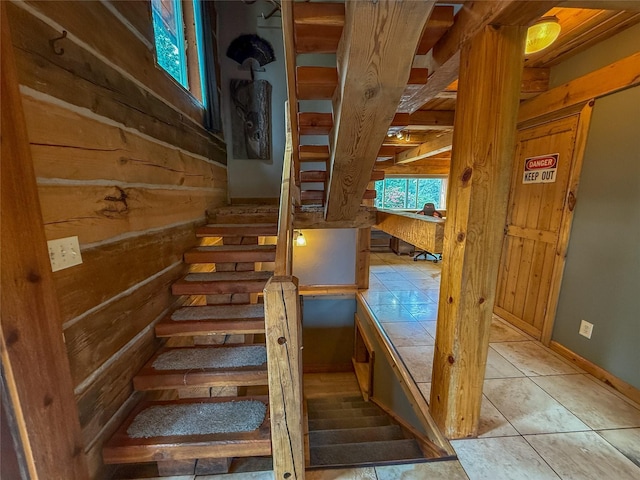 23254 Dayton Creek Rd, Proctor, MT 59929 - stairs featuring wood walls and tile patterned flooring
