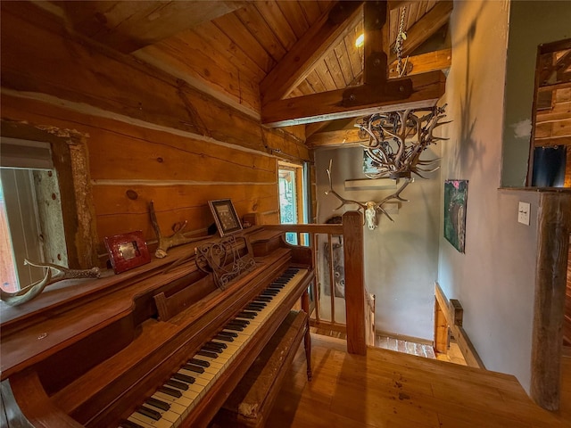 23254 Dayton Creek Rd, Proctor, MT 59929 - corridor featuring an upstairs landing, a wood ceiling with exposed beams, hardwood / wood-style flooring, and wooden walls