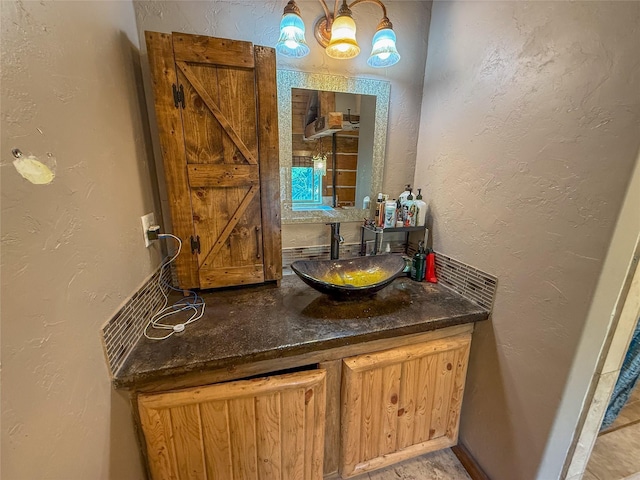 23254 Dayton Creek Rd, Proctor, MT 59929 - bathroom with a textured wall and vanity