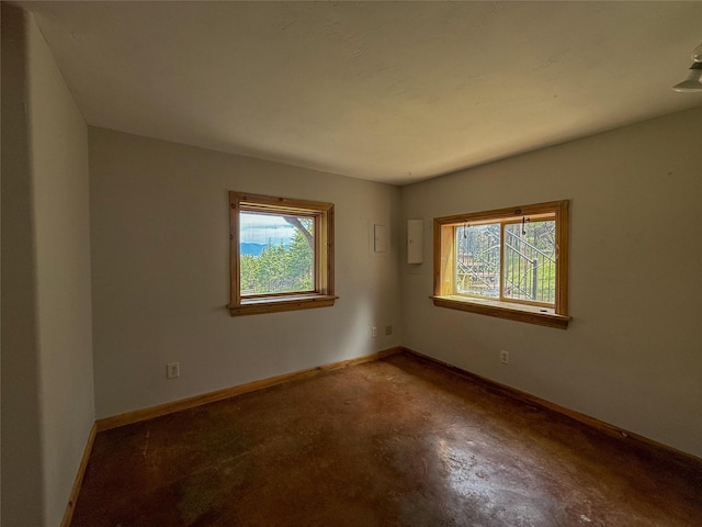 23254 Dayton Creek Rd, Proctor, MT 59929 - spare room featuring baseboards and concrete floors