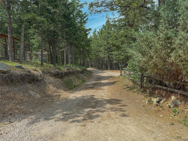 23254 Dayton Creek Rd, Proctor, MT 59929 - view of dirt / gravel road with a forest view