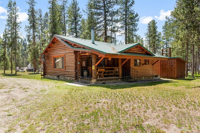 392 Leisure Ln, Sula, MT 59871 - rear view of property featuring log exterior and a metal roof