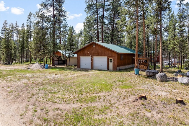 392 Leisure Ln, Sula, MT 59871 - view of home's exterior featuring a garage and an outdoor structure