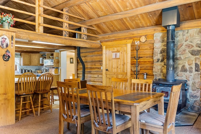 392 Leisure Ln, Sula, MT 59871 - carpeted dining area with a wood stove, wooden ceiling, and rustic walls