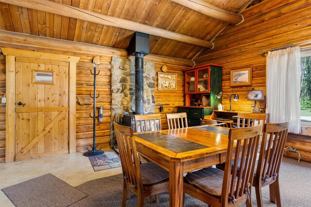 392 Leisure Ln, Sula, MT 59871 - dining area with a wood stove, rustic walls, and wood ceiling