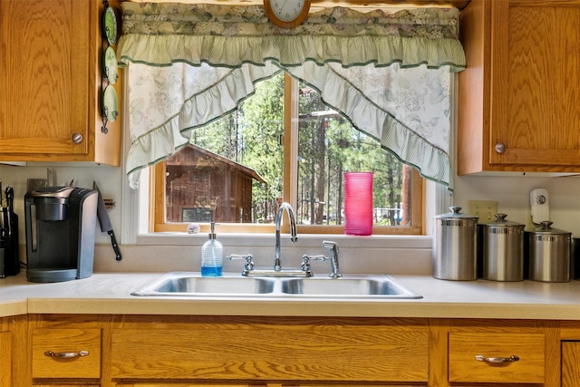 392 Leisure Ln, Sula, MT 59871 - kitchen with plenty of natural light, light countertops, and brown cabinets