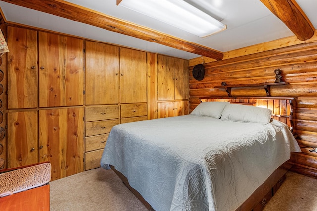 392 Leisure Ln, Sula, MT 59871 - bedroom with rustic walls, carpet, and beamed ceiling