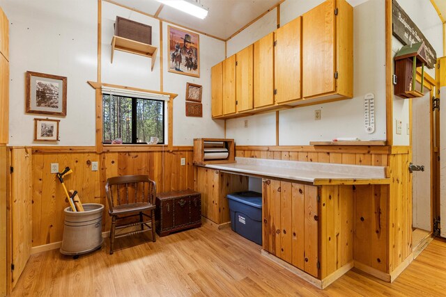 392 Leisure Ln, Sula, MT 59871 - home office featuring a wainscoted wall, light wood finished floors, and wooden walls