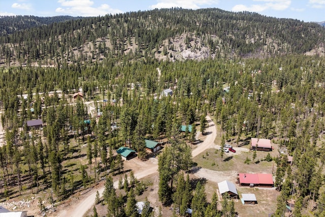 392 Leisure Ln, Sula, MT 59871 - aerial view of property and surrounding area featuring a forest and a mountainous background