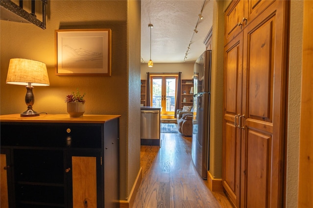 62 S Last Chance Gulch Gulch Unit 5, Helena, MT 59601 - hall featuring wood finished floors, rail lighting, a textured wall, and a textured ceiling