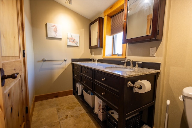 62 S Last Chance Gulch Gulch Unit 5, Helena, MT 59601 - bathroom with double vanity and stone finish floors